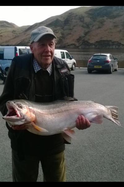 Mr Hart with fishery record rainbow trout 25lb 4oz taken on olive wooly bugger 

